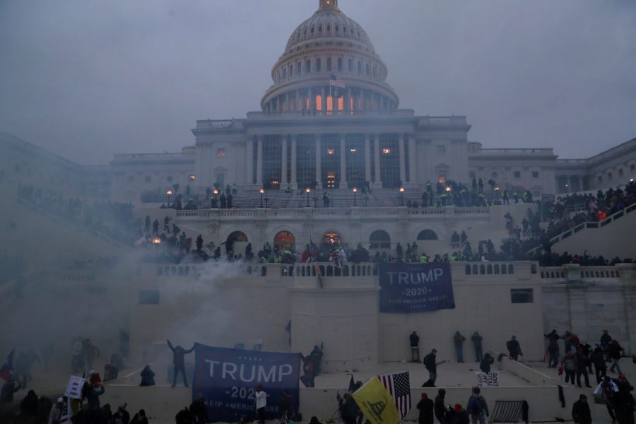 Police+officers+stand+guard+as+supporters+of+U.S.+President+Donald+Trump+gather+in+front+of+the+U.S.+Capitol+Building+in+Washington%2C+U.S.%2C+January+6%2C+2021.+REUTERS%2FLeah+Millis+++++TPX+IMAGES+OF+THE+DAY