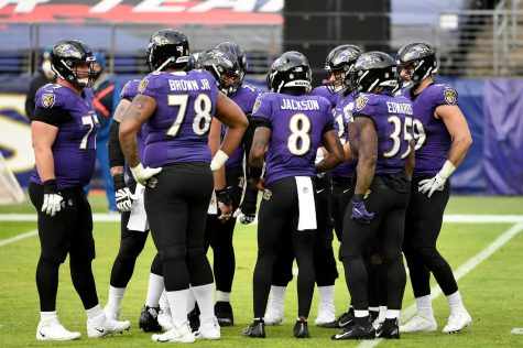 BALTIMORE, MARYLAND - DECEMBER 20: Quarterback Lamar Jackson #8 of the Baltimore Ravens calls a play in the huddle during the second half against the Jacksonville Jaguars at M&T Bank Stadium on December 20, 2020 in Baltimore, Maryland. (Photo by Will Newton/Getty Images)